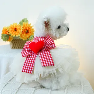 Detail of multi-layer tulle pet dress with red gingham bow and heart for small dogs