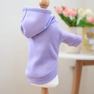 Detail of lavender pet hoodie with ribbed cuffs and soft knit fabric on a wooden stand