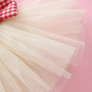Red checkered heart bow on tiered cream tulle pet dress for Valentine's Day