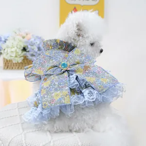 Detail of pet floral lace dress with large bow and gemstone for dogs and cats