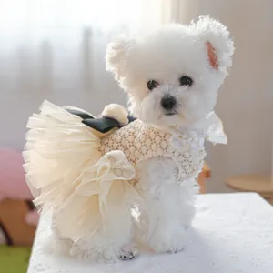 Detailed view of dog princess dress featuring crochet lace, layered tulle and black satin bow