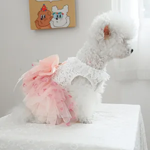 Pink heart patterned pet princess dress with white lace bodice and bow for small dogs