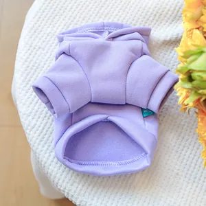 Detail of lavender pet hoodie with fleece lining and ribbed cuffs on white textile