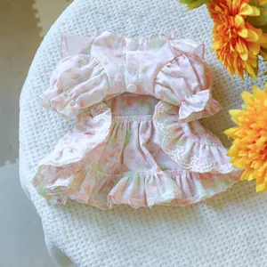 Close-up of pink floral pet dress featuring bubble sleeves and delicate lace hem details