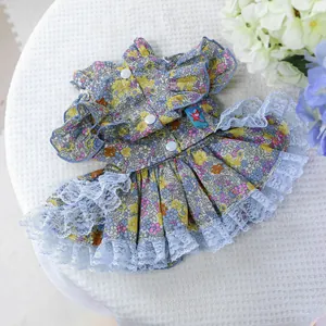 Detail of floral pet wedding dress with multilayered blue tulle and snap button closure