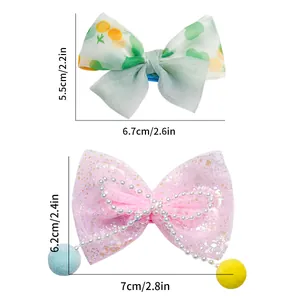 Set of cute floral bow and pink mesh hair clips with pearls and pompoms for small dogs