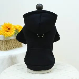 Detail of black pet hoodie with D-ring and pocket on white display stand