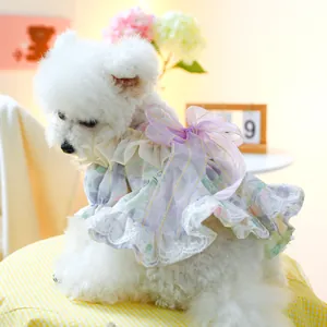 Detail of pet floral dress with a large purple organza bow and white lace embroidery