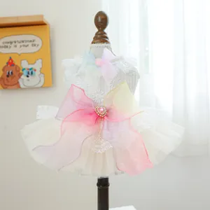 Detail of pet wedding dress with lace mesh skirt and large gradient organza bow