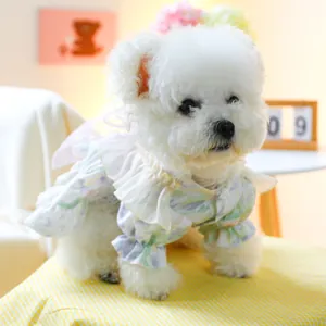 Detail of pet floral dress showing ruffle neckline and puff sleeves on white dog