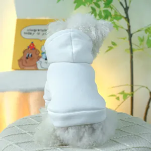 Rear view of a white dog wearing a classic white pet hoodie with ribbed elastic hem