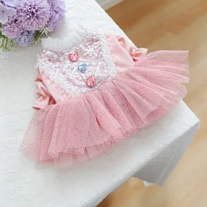 Detailed view of pink pet tutu dress with sequin embroidery and heart gemstones