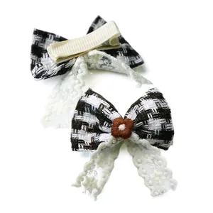 Detail of tweed bow hair clips with lace trim and metallic duckbill clip for pets