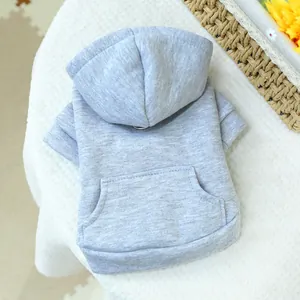 Detail of light gray pet hoodie featuring a cozy hood and decorative kangaroo pocket