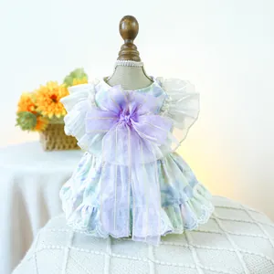 Detail of pet floral dress showing large purple organza bow and delicate white lace embroidery