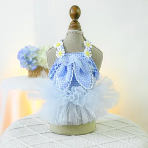 Detail of pet dress with sky blue gingham, white daisies and a large mesh bow