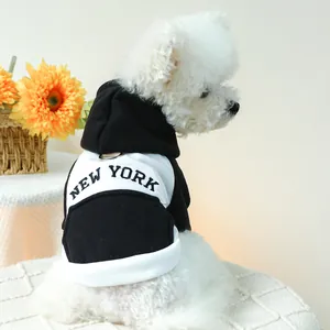 Detail of a black and white New York pet hoodie with a metal D-ring for a leash