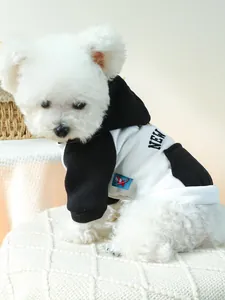 Detail of pet hoodie with NEW print and decorative pocket on white dog model