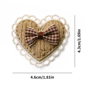 Detail showing dimensions of heart-shaped knitted pet hair clip with lace and bow