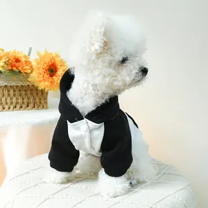 Close-up of black and white color-block pet hoodie with snap button closure and hood