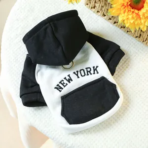 Detail of NY dog hoodie showing the metal D-ring for leash attachment and soft cotton fabric