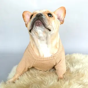 Detail of soft khaki knit fabric and ribbed cuffs on a Christmas dog sweater