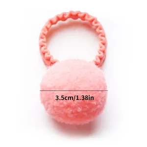 Detail of pink plush ball hair tie showing 3.5cm diameter for pets and girls