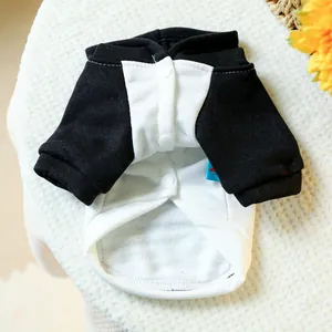 Detail of pet tuxedo shirt with black and white contrast fabric and white button closure