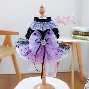 Detail of Halloween pet dress with velvet bodice, purple mesh tutu and jewel bow