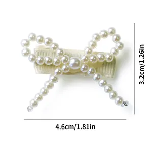 Detail of cute white pearl bow hair clip for pets with precise 4.6cm size measurements