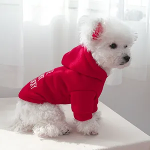 Close-up of red dog hoodie with white Lucky lettering and soft hooded fabric detail