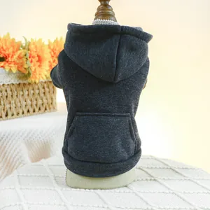Detail of solid dark grey pet hoodie with functional kangaroo pocket and ribbed cuffs