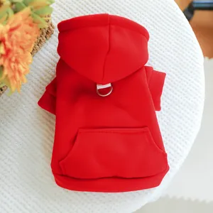 Detail of red pet hoodie with metal D-ring for leash and small pocket on fleece fabric