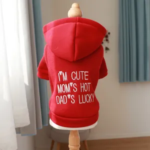 Close-up of red dog hoodie with white 'I'M CUTE' embroidery on thick fleece fabric