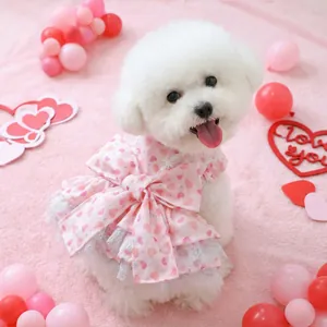 Cute pink pet dress with red heart patterns and a large bow for small dogs and cats