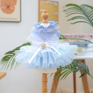 Blue pet princess dog dress with daisy prints, lace trim, and a large mesh bow detail