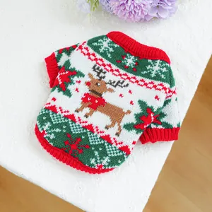 Detail of Christmas reindeer knit pet sweater with festive red ribbing and snowflakes