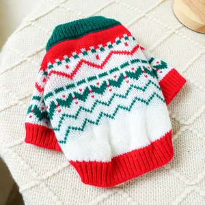 Detailed close-up of a Christmas pet sweater with red heart patterns and ribbed neck