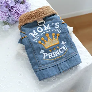 Detailed view of light blue denim pet vest with lamb wool collar and Mom's Prince embroidery