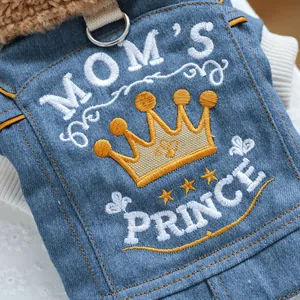 Detail of embroidered Mom's Prince text and crown on blue denim dog jacket with fur trim