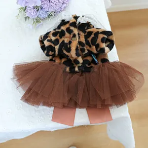 Close-up of leopard print pet dress with white lace collar and layered tulle skirt