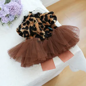 Detail of leopard print plush pet dress with lace collar and brown tulle skirt layers
