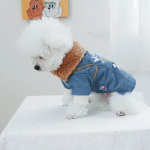 Detail of denim pet jacket with warm faux shearling collar and white letter embroidery