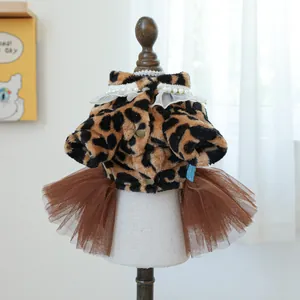 Detail of leopard print pet dress with plush fabric, lace collar, and brown tulle skirt