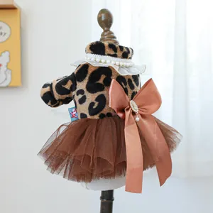 Detailed view of leopard print pet dress with layered tulle skirt and satin bow decoration