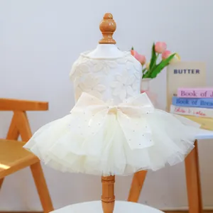 Elegant off-white pet wedding dress with daisy lace patterns and large satin bow tie