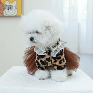 Close-up of leopard print pet dress with pearl lace collar on a small dog
