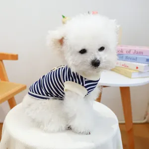 Detail of blue and white striped pet t-shirt with ribbed edges on a small white dog