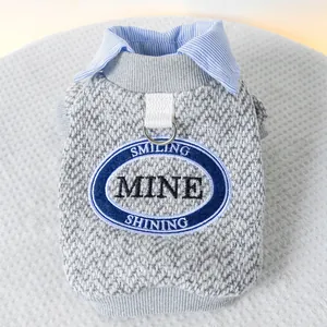 Gray knitted pet sweater with striped collar and D-ring harness attachment for dogs