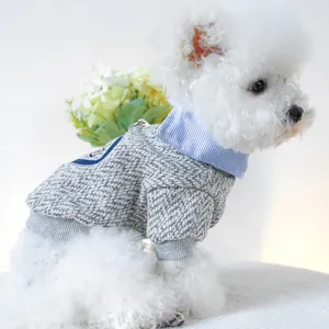 Detail of grey knitted pet sweater with shirt collar, embroidery and leash D-ring